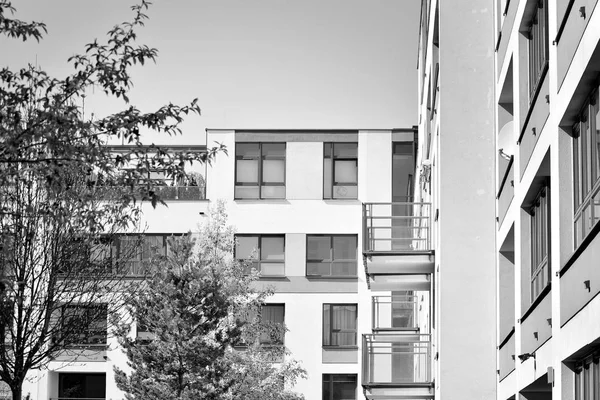 Modern apartment building exterior. Black and white.