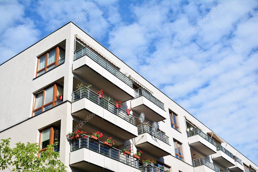 Modern apartment buildings on a sunny day with a blue sky. Facade of a modern apartment building