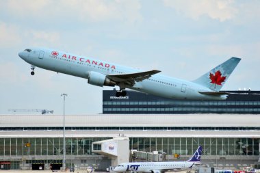 Warsaw, Poland. 26 July 2018. Airplane  C-FTCA Air Canada Boeing 767-375(ER) taking off from the Warsaw Chopin Airport. clipart