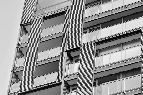 Modern apartment building exterior. Black and white.