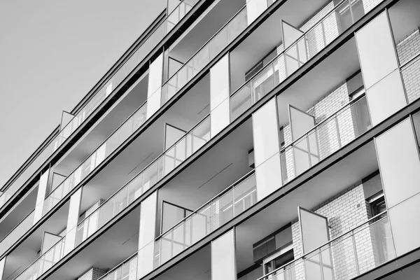 Modern apartment building exterior. Black and white.