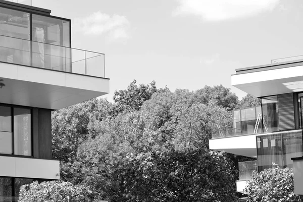 Modern apartment building exterior. Black and white.