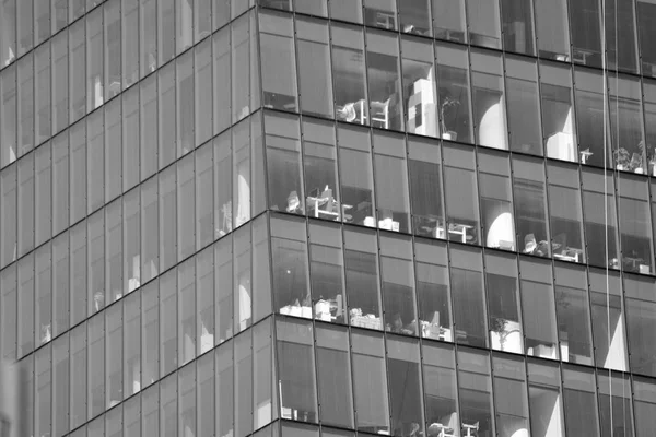 Modern apartment building exterior. Black and white.