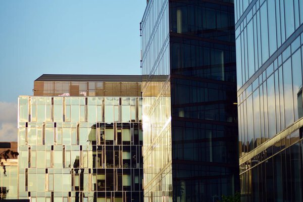 Abstract fragment of contemporary architecture, walls made of glass and concrete.Glass curtain wall of modern office building