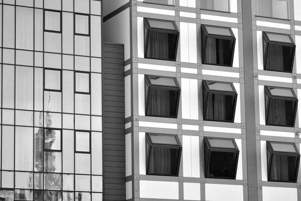 stock image Modern apartment buildings on a sunny day with a blue sky. Facade of a modern apartment building. Black and white.