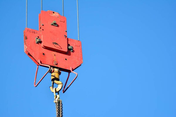 Crane hook on a blue sky