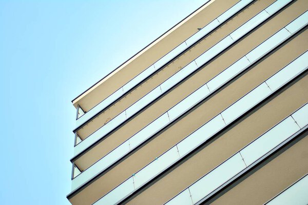 Modern apartment buildings on a sunny day with a blue sky. Facade of a modern apartment building