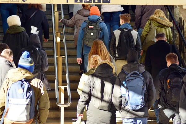 Blurry photo of people walking up and down the stairs