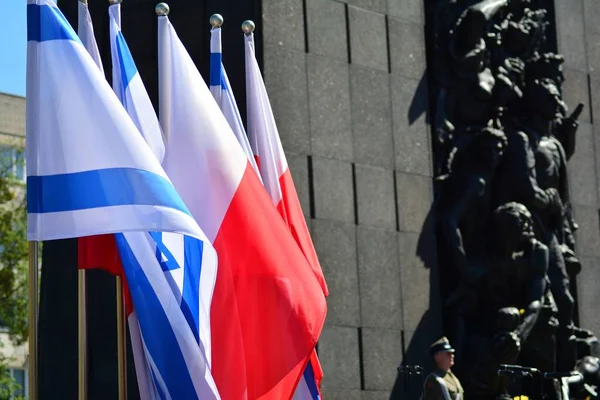 Poland and Israel flag waving in the wind. Israel and Poland two flags textile cloth.