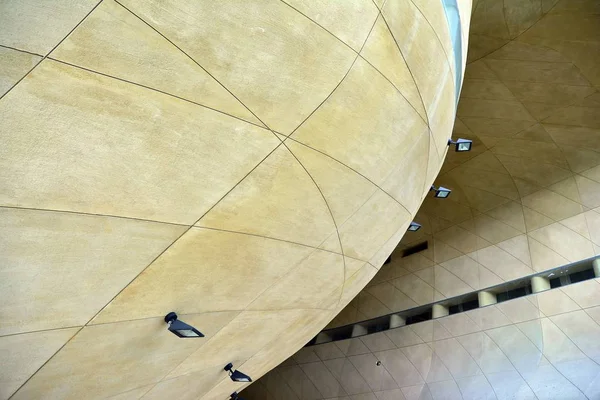 Architecture details wall curve concrete cement abstract background. Modern architecture detail. Refined fragment of contemporary public building.