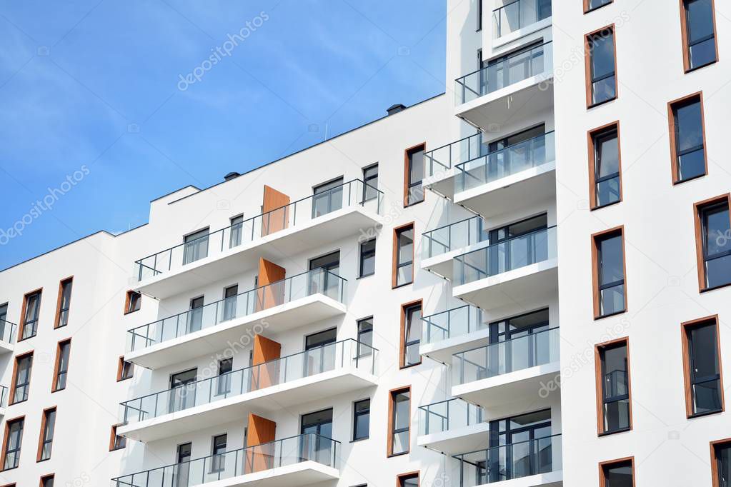 Multistory new modern apartment building. Stylish living block of flats.