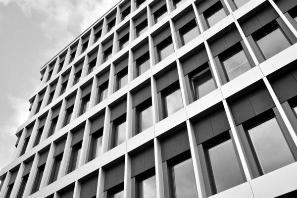 The windows of a modern building for offices. Business buildings architecture. Black and white.