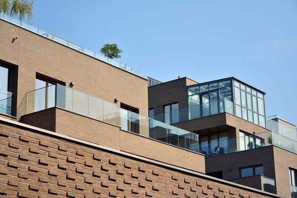 Modern apartment buildings on a sunny day with a blue sky. Facade of a modern apartment building