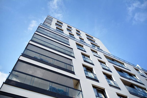 Modern and new apartment building. Multistoried modern, new and stylish living block of flats.