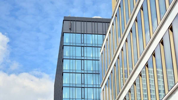 Facade texture of a glass mirrored office building. Fragment of the facade. Modern architecture of the office building.