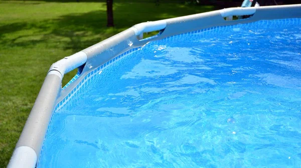 Frame pool in the garden of a private house, summer