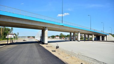 View of the new highway under construction. clipart