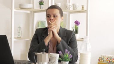Unhappy business woman eating for stress