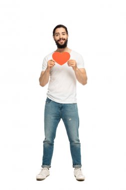 bearded latin man holding red heart-shape carton and smiling isolated on white  clipart