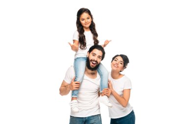 happy latin father carrying on shoulders cute daughter showing thumbs up near happy wife isolated on white  clipart