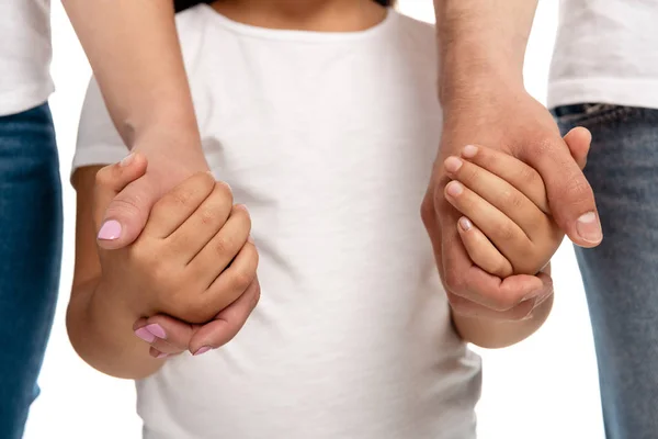 裁剪视图的父母手牵手与女儿隔离在白色 — 图库照片