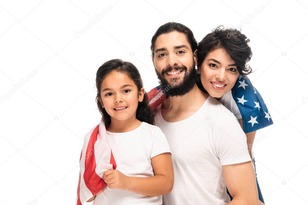 happy latin family smiling while holding american flag isolated on white 