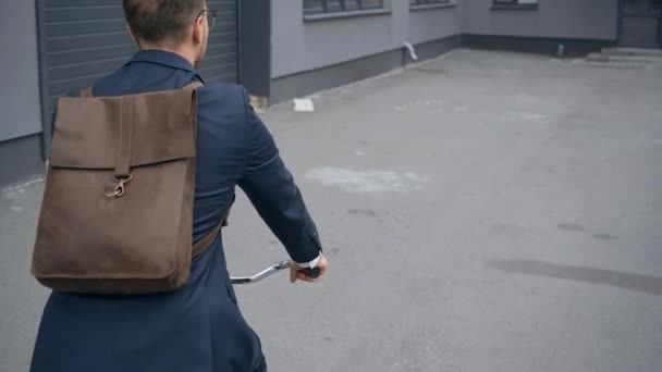 Back View Businessman Backpack Riding Bicycle Building — Stock Video