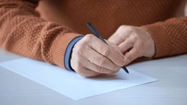 Cropped View Senior Man Holding Pen While Writing Paper — Stock Video