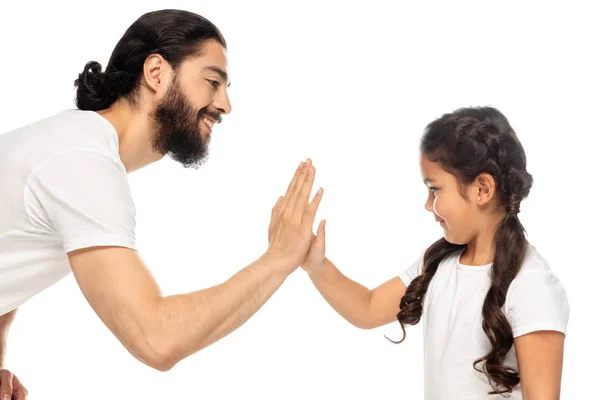 Cheerful latin father giving five to cute daughter isolated on white — Stock Photo