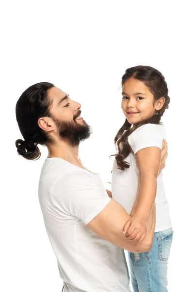 Happy latin man holding in arms cheerful daughter isolated on white — Stock Photo