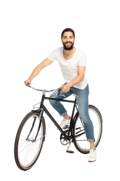 Alegre latino homem andar de bicicleta isolado no branco — Fotografia de Stock
