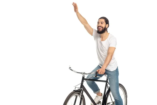 Alegre latino homem andar de bicicleta e gesto isolado no branco — Fotografia de Stock
