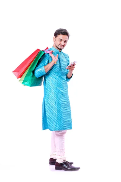 Indian Man Ethnic Wear Shopping Bags Showing Mobile Screen Isolated — Stock Photo, Image