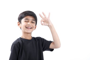 Indian child showing nice gesture with hand