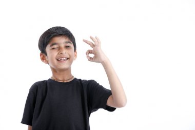 Indian child showing nice gesture with hand