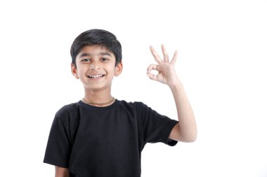 Indian child showing nice gesture with hand