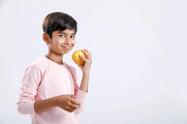 Cute Indian Asian Little Boy Eating Mango Multiple Expressions Isolated — Stockfoto