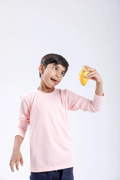 Cute Indian Asian Little Boy Eating Mango Multiple Expressions Isolated — Φωτογραφία Αρχείου
