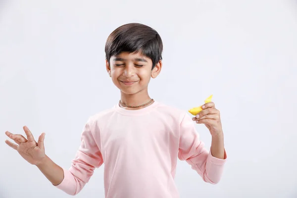 Cute Indian Asian Little Boy Eating Mango Multiple Expressions Isolated — Stockfoto