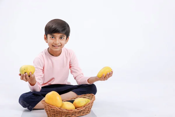 Cute Indian Asian Little Boy Eating Mango Multiple Expressions Isolated Fotos De Stock
