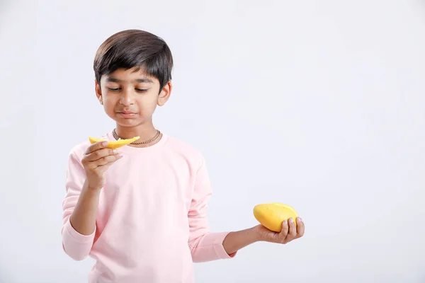 Cute Indian Asian Little Boy Eating Mango Multiple Expressions Isolated Imágenes De Stock Sin Royalties Gratis
