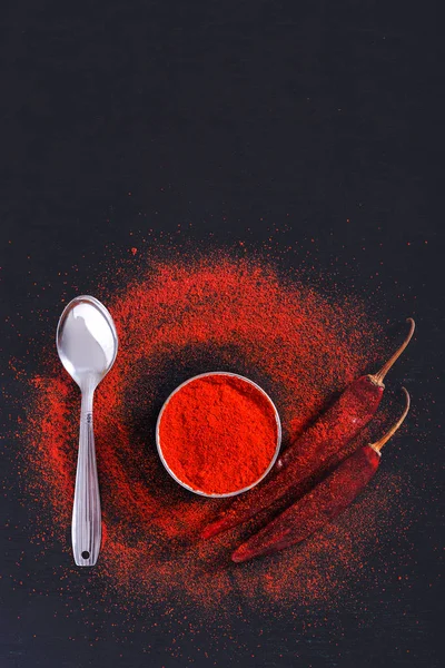 Red Chili Pepper Flakes Chili Powder Burst Black Background — стоковое фото