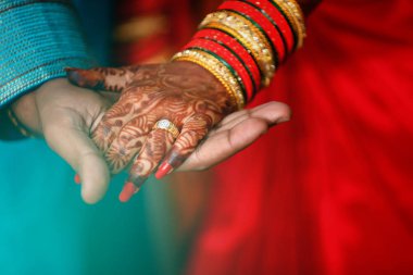 Golden engagement ring in hand