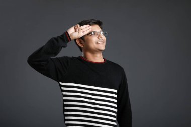young indian man salute