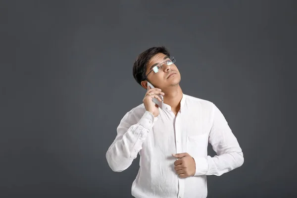 Young Indian Talking Mobile Phone — Stockfoto