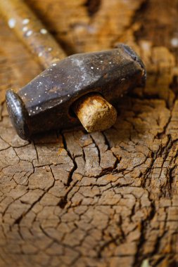 Using hammer and nail on wood
