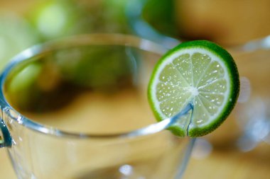 Empty glass cup with lemon