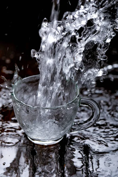 water splash in glass cup