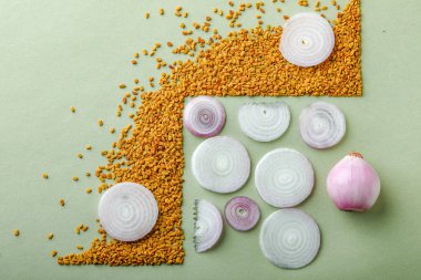 composition of red onions and spices on table