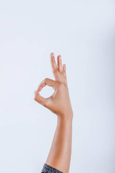 Human Hand showing Ok Gesture